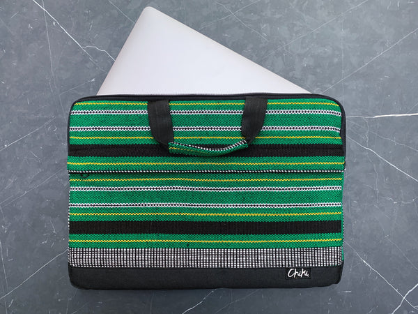 A green and black striped laptop bag with a 13 inch laptop inside. The name of the laptop bag is Cebu.
