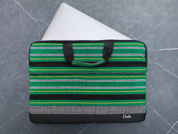 A green and black striped laptop bag with a 13 inch laptop inside. The name of the laptop bag is Cebu. 