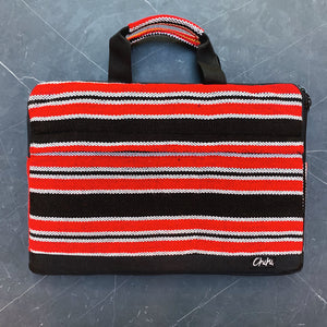A laptop bag with red, black and white stripes and has handles. The name of the laptop bag is Davao.